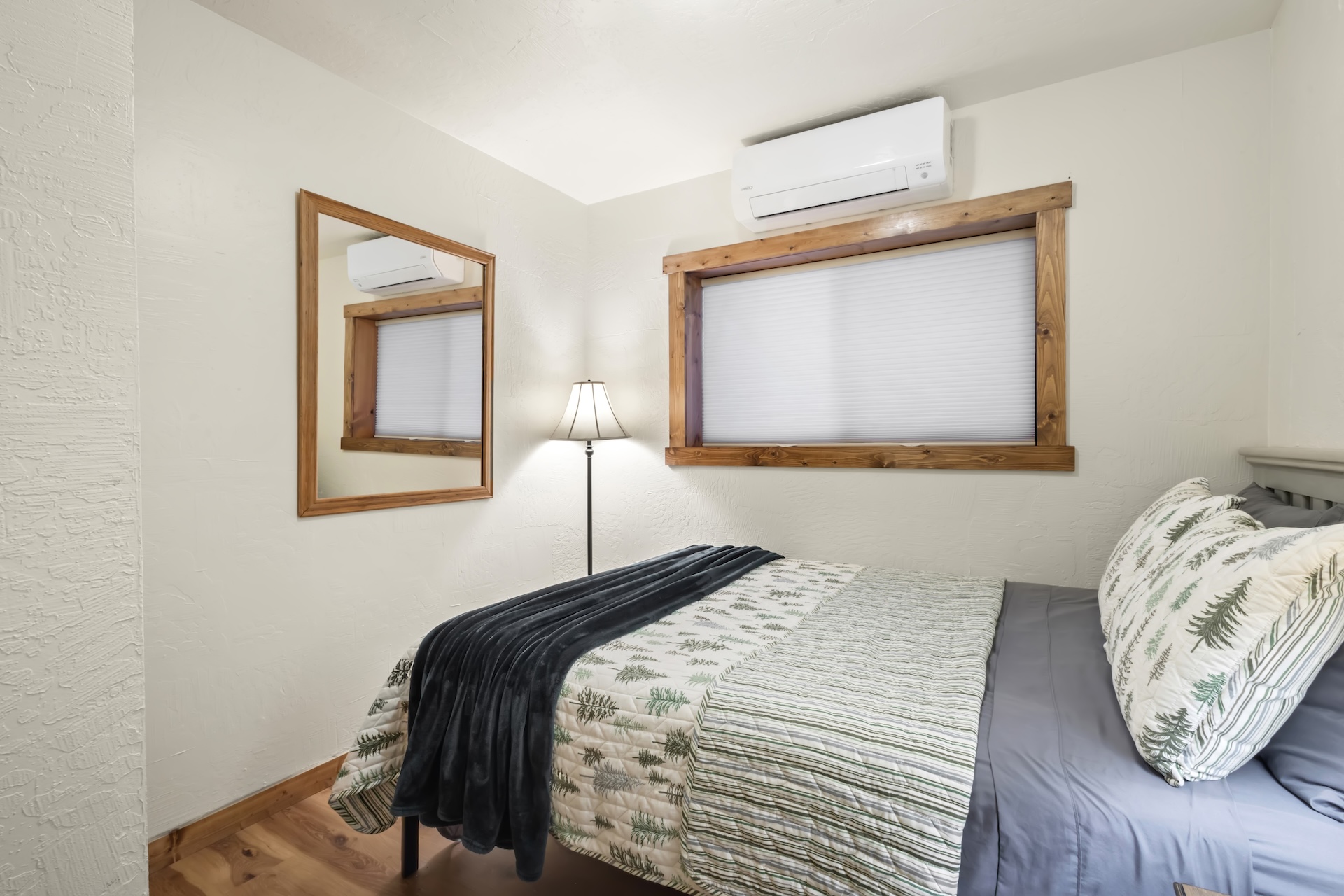 Ground-Floor Suite: Queen Bed with ensuite bathroom, private exterior entrance, and living area with TV, small refrigerator, wet bar and electric fireplace (1st Floor)