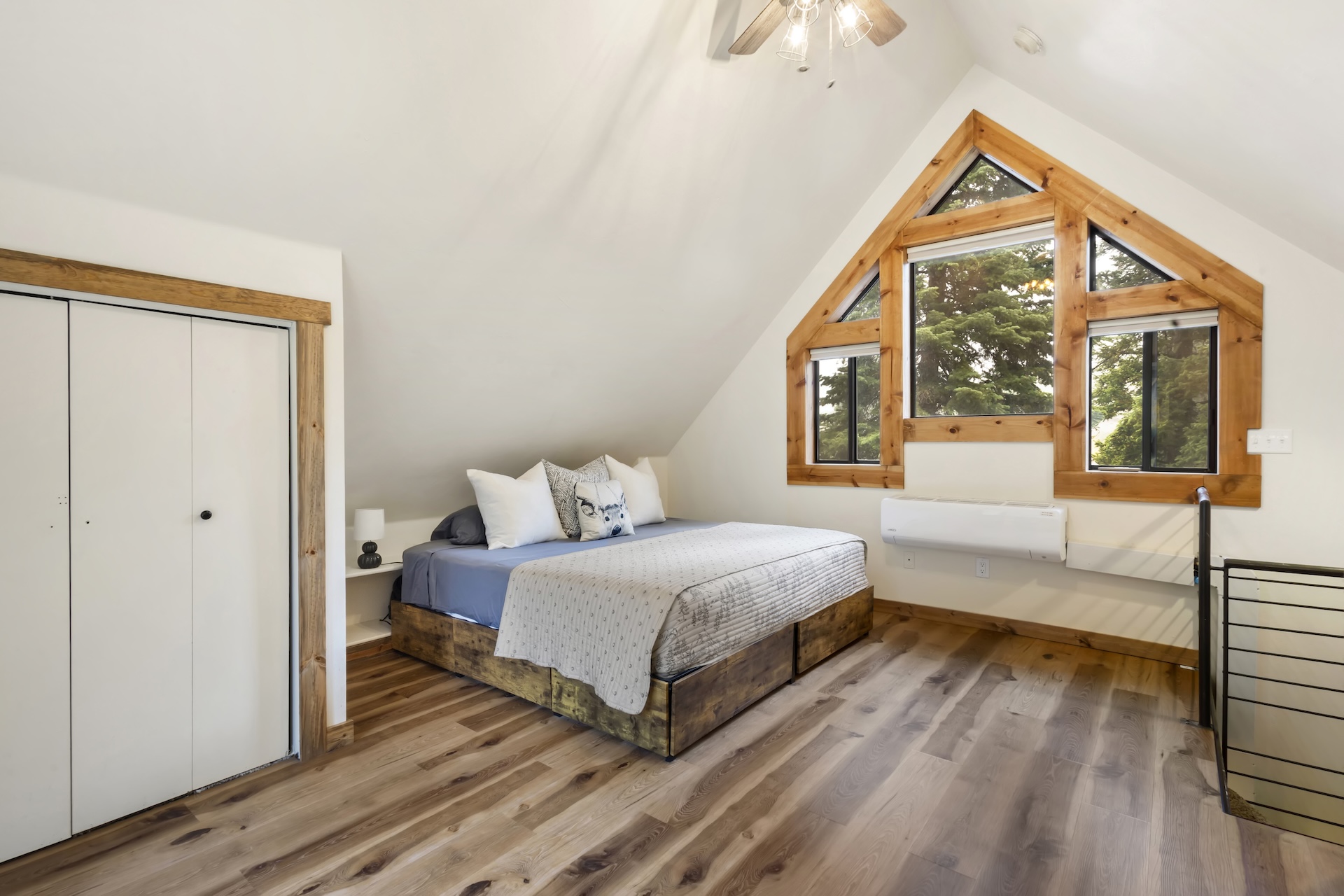 Loft Bedroom: King Bed, bay window, and oversized leather reading chair (4th Floor)