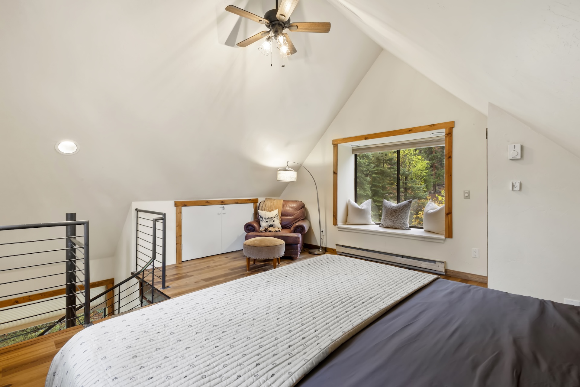 Loft Bedroom: King Bed, bay window, and oversized leather reading chair (4th Floor)