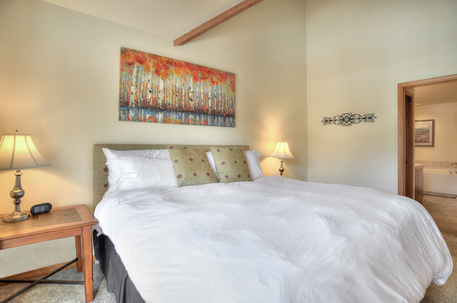 Master bedroom with views, king size bed, TV, and deck (Upstairs)