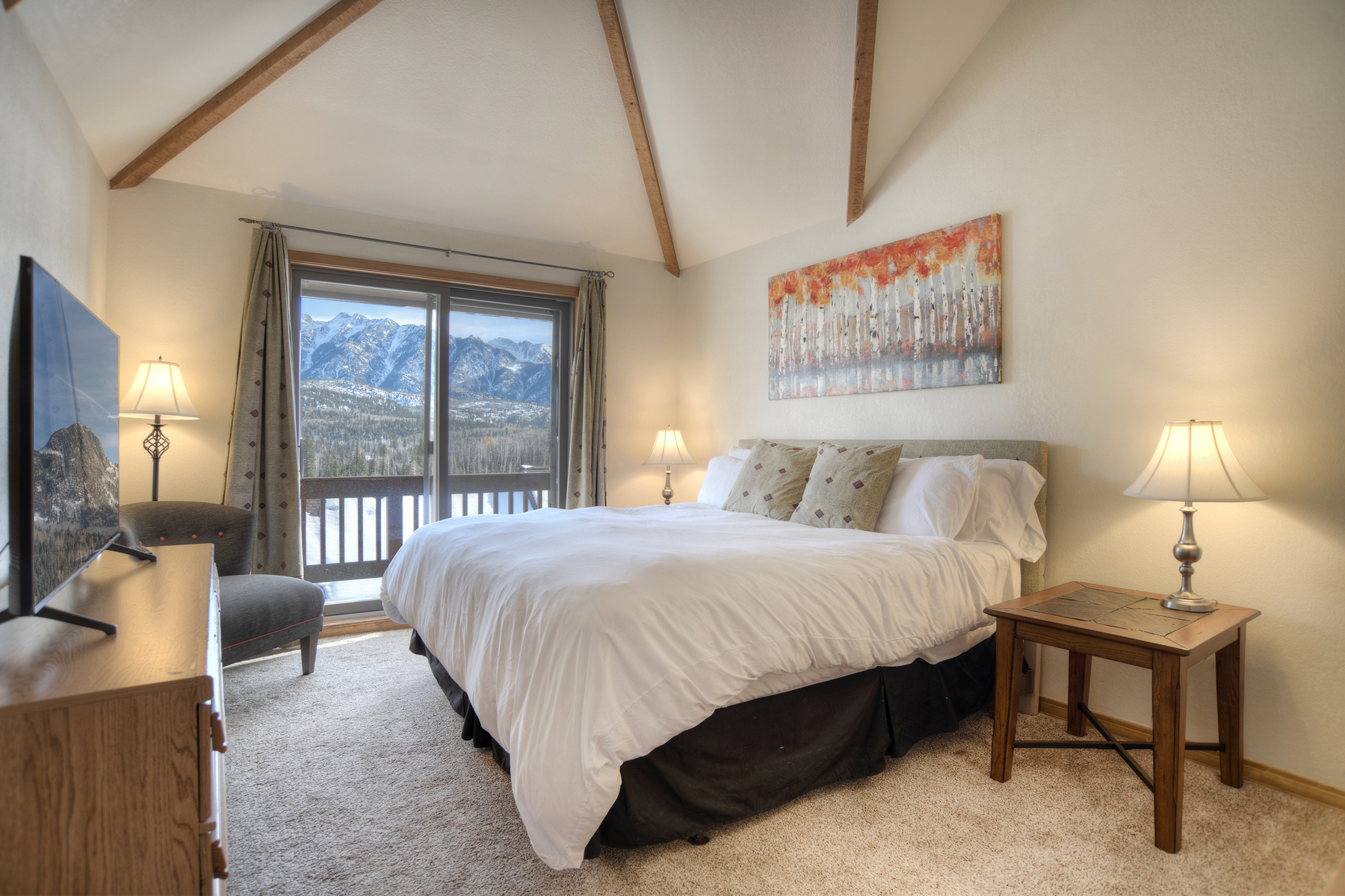 Master bedroom with views, king size bed, TV, and deck (Upstairs)
