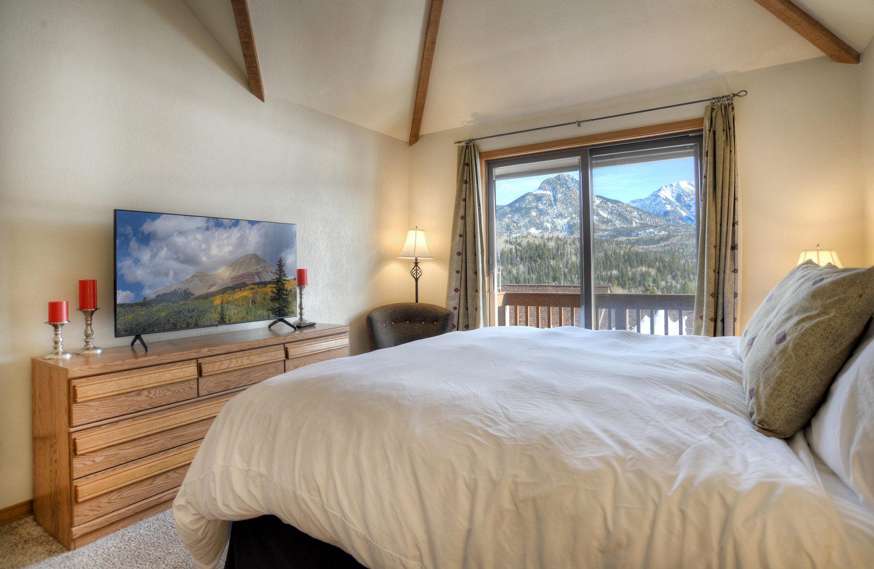 Master bedroom with views, king size bed, TV, and deck (Upstairs)
