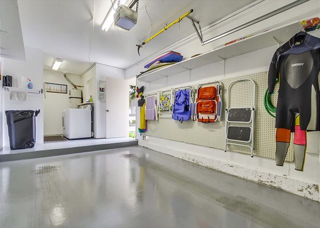 Garage with beach chairs & boogie boards