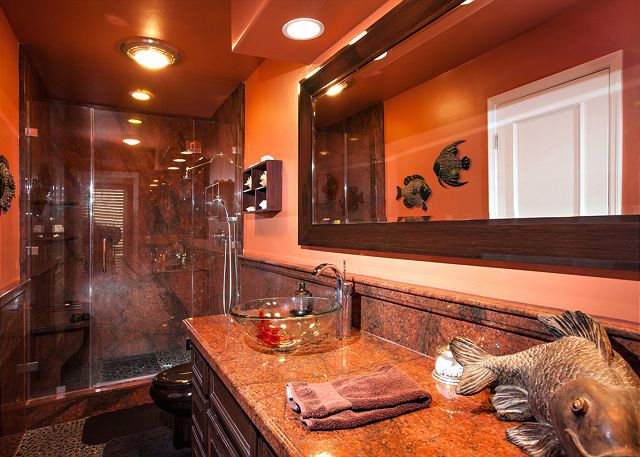 Beautifully decorated bathroom with large step-in shower