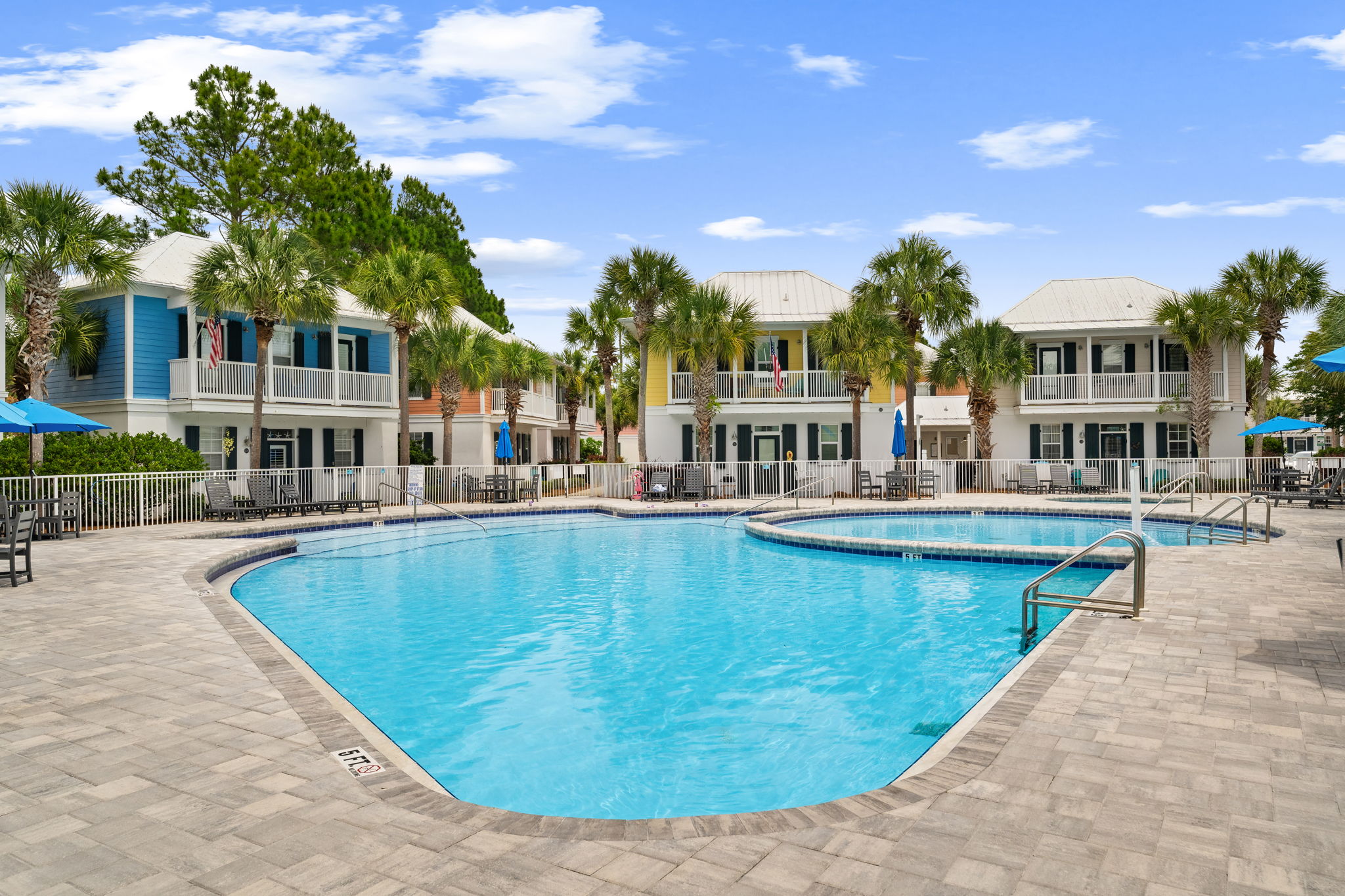 Community pool and colorful coastal homes at Kenesaw Kabana in the Bungalows at Seagrove