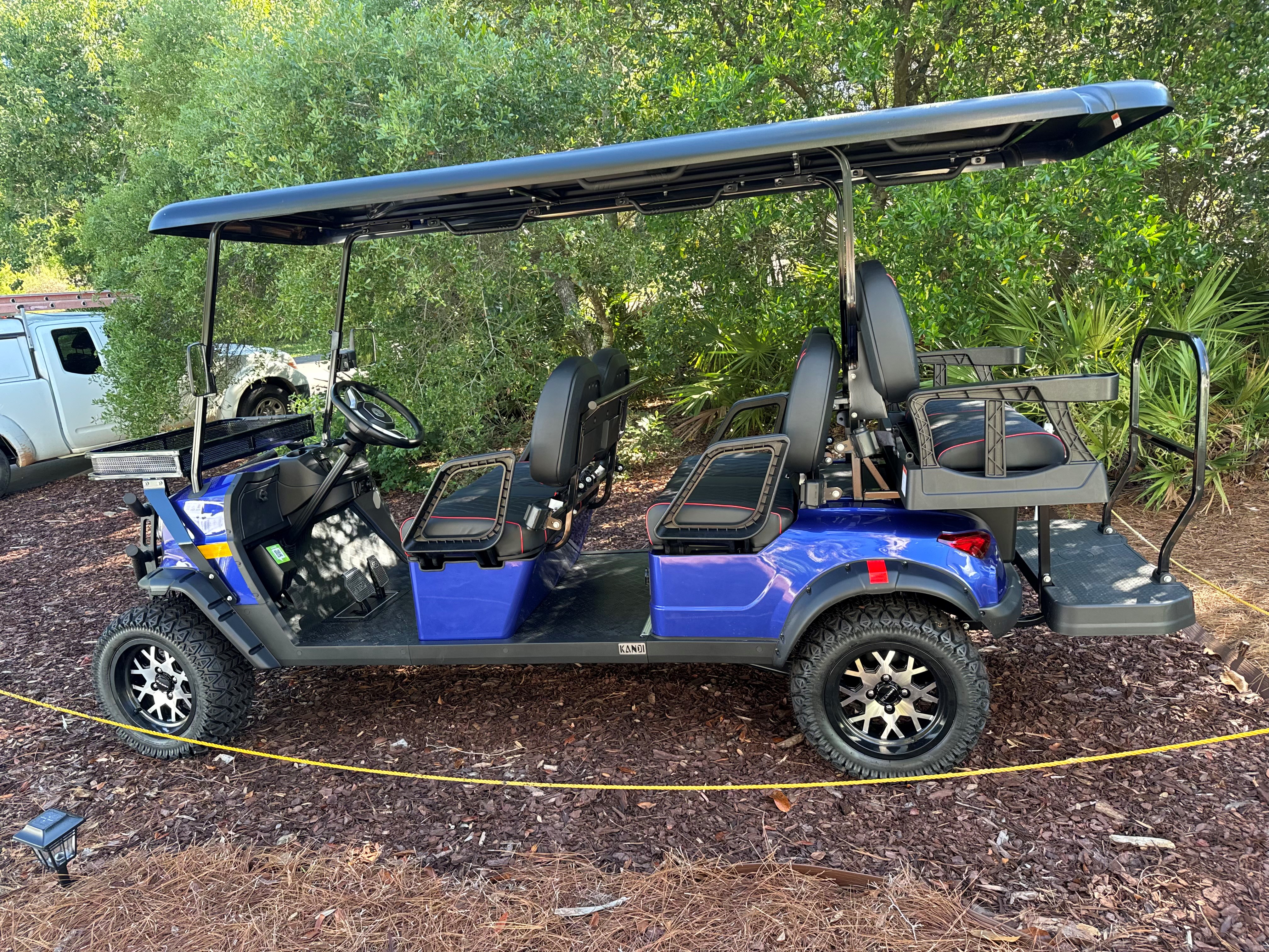 Six-seat golf cart available to eligible Barefoot Paradise guests