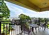 This alternate view from the balcony shows your direct line to the Atlantic—just steps from your door and framed by palms and rooftops. Grab a drink and watch the tide roll in.