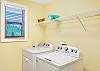 Pack light—this full laundry room comes with a washer, dryer, and shelf space to keep things easy breezy, whether you're here for a weekend or a whole month.