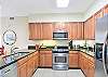 Stocked with all the essentials and then some—this kitchen features granite countertops, stainless appliances, and plenty of cabinet space for snacks, beach drinks, and big family breakfasts.