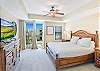 Wake up to palm trees and ocean glimpses in this bright, spacious primary suite. Features a plush king bed, direct balcony access, and a flat-screen TV—perfect for slow mornings and salty breezes.