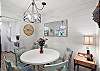 Coastal charm meets casual comfort at this intimate dining nook. Perfect for shrimp po’boys, card games, or slow breakfasts before your beach walk.