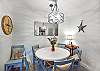 Another look at the dining nook shows off coastal flair, sweet lighting touches, and the kind of space that makes everyday meals feel special.