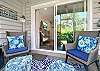 Start your day with coffee or end it with wine on this cozy screened patio, just off the living room. Surrounded by greenery and styled with plush seating, it’s a peaceful place to soak in island time.

