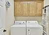 Pack light—this unit includes a full-size washer and dryer with overhead storage. Ideal for families, beach days, or extended stays.

