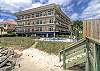 The boardwalk from the beach leads straight to Sea Point Lodge 208. Just a few steps over the tide wall and you’re on the sand—no streets to cross, and the ocean’s always just a minute away.
