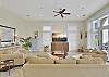 Another look at the open living space, with plush seating, smart TV, and direct access to the balcony. Whether it's game night or movie morning, this room is built for together time.

