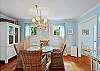 Charming dining space with a round table, natural light, and seating for four—perfect for dinner, games, or morning planning sessions.

