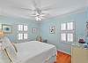 Another angle of the king bedroom—soft light and hallway access add comfort and flow.
