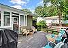 This St. Simons Island vacation rental features a large back deck with lounge seating, a grill, and space to enjoy dinner or drinks outdoors at 204 Ashantilly Avenue.