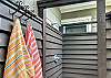 A closer look at the outdoor shower at 204 Ashantilly Avenue—ideal for rinsing off after the beach without bringing the sand inside.