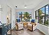 This view shows how the windowed sitting area connects to the primary suite. Bright light, comfy chairs, and a peaceful corner that works whether you’re reading or retreating.


