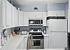 This bright, coastal kitchen has full-size appliances, a deep sink, and everything you need to handle dinner, coffee, or just a 10 p.m. Pop-Tart moment. It’s practical, unfussy, and quietly well-equipped. Like most of your best friends.
