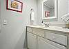 The ensuite bathroom is bright, roomy, and practical. There’s plenty of counter space, good lighting for getting ready, and a full tub/shower combo just out of frame.