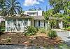 Just steps from Frosty’s Grill, Village Inn & Pub, and the Pier, this Magnolia Avenue vacation rental brings you as close to downtown St. Simons as it gets. The charming front exterior is tucked under mossy oaks and palm fronds, with gravel parking for 4+, a covered porch, and plenty of room for your golf cart—or your boat.
