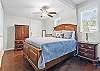 This queen bedroom feels like a suite, with high ceilings, natural light, and a private ensuite bathroom. It’s tucked away just enough to offer a little extra peace and privacy—perfect for couples, grandparents, or anyone who likes their own space after a day at the pier.

