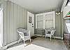 This is your welcome moment: a quiet, covered front porch that opens into the heart of your St. Simons vacation. Whether you're coming back from the beach or heading out for dinner, this space is equal parts entryway and exhale.

