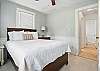 This queen bedroom sits just off the main hallway and offers easy access to the shared bathroom. It’s clean, bright, and works well for anyone who likes to be near the action—but still close the door when it’s time to wind down.