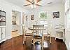This sunny dining nook keeps things simple and sweet—just like life on St. Simons. The space opens to the living room and kitchen, creating a natural flow for meals, card games, or mapping out your next stop (spoiler: it’s probably Frosty’s or the pier). Ceiling fan included for those who run warm.
