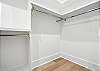 The primary bedroom includes a roomy walk-in closet—plenty of space to unpack, stay organized, and avoid living out of a suitcase.

