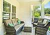 This shaded patio offers the perfect spot to relax after the beach—plush outdoor seating, island air, and plenty of room to gather.