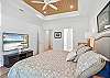 One last look at the king suite—tray ceilings, streaming TV, and a direct walk-through to the spa-style bath for quiet, no-rush mornings.