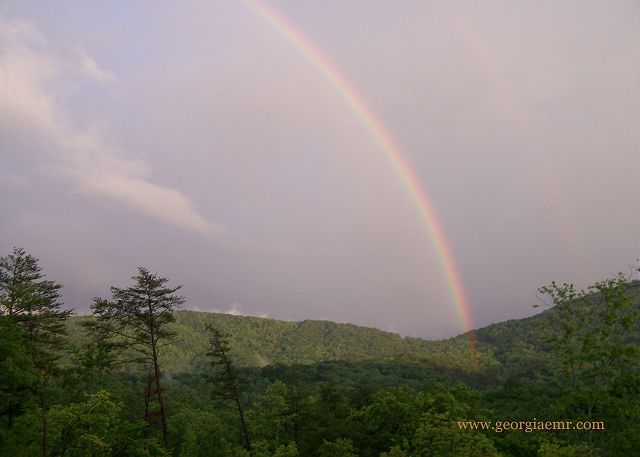 Magic moments under the rainbow after a thunderstorm