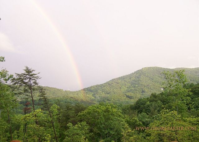 Magic moments under the rainbow after a thunderstorm