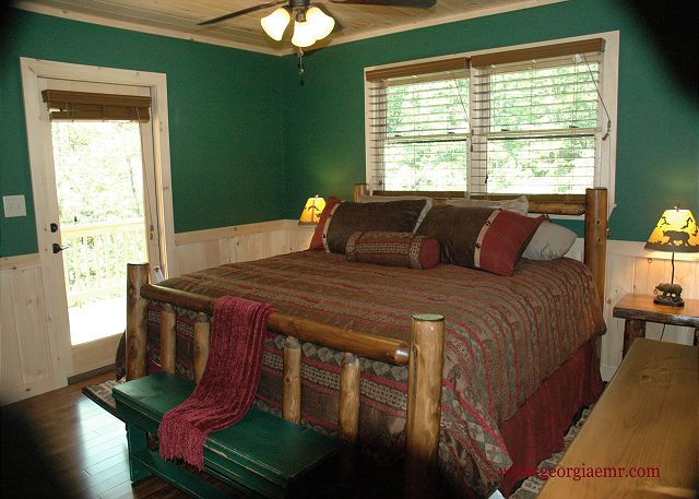 Main Floor King size bedroom, access to back covered porch, full bathroom
