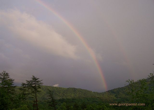 Magic moments under the rainbow after a thunderstorm