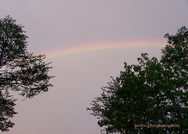 Magic moments under the rainbow after a thunderstorm