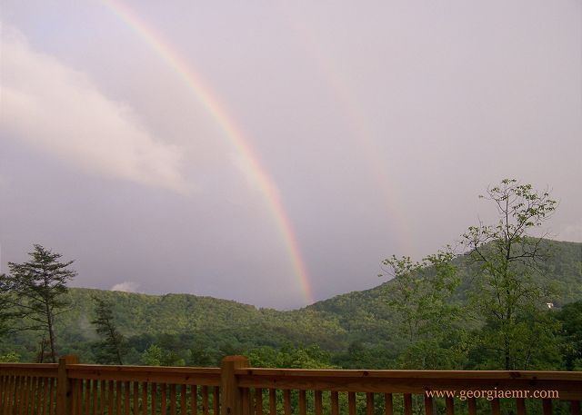 Magic moments under the rainbow after a thunderstorm