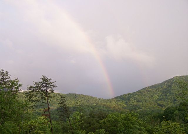 Magic moments under the rainbow after a thunderstorm