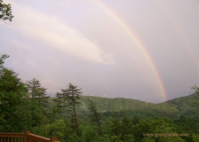 Magic moments under the rainbow after a thunderstorm