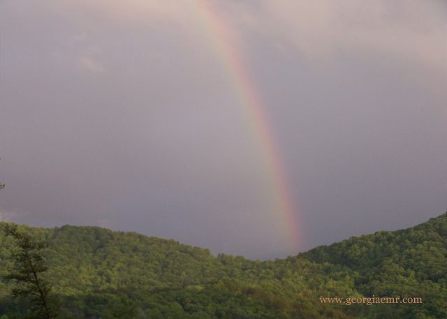 Magic moments under the rainbow after a thunderstorm