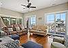 Living room on the second floor with a balcony and screened in porch