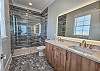 The second floor master bathroom with handcrafted tile shower