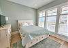 This first floor bedroom has a comfortable queen bed & amazing Bay views