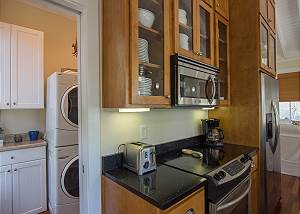 Laundry area with full size washer and dryer.