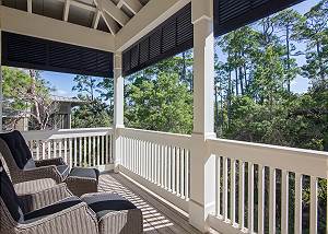 The covered balcony is a perfect space to enjoy your morning coffee or evening cocktail.