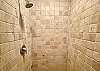 Cream colored stone shower.